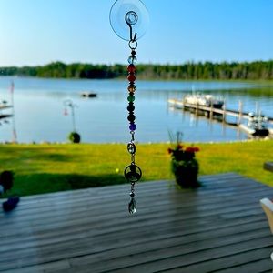 Handmade crystal and gemstone chakra suncatcher.